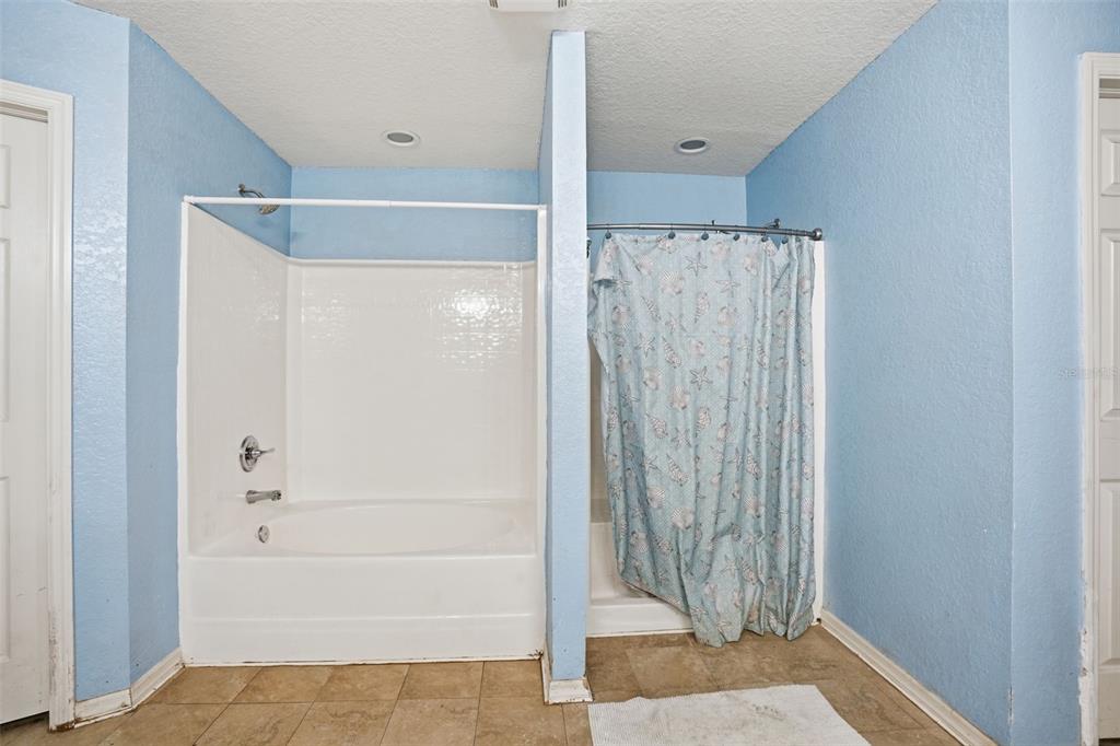 10490 Mayflower Road Spring Hill, FL 34608 - Photo 22 of 35 a bathroom with a shower