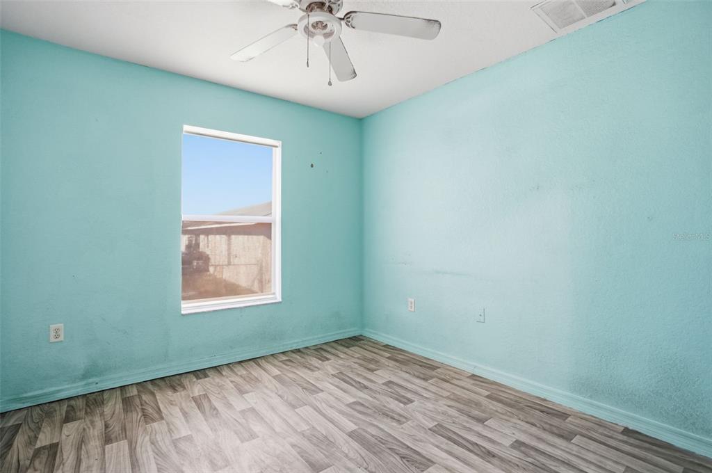 10490 Mayflower Road Spring Hill, FL 34608 - Photo 23 of 35 an empty room with a window