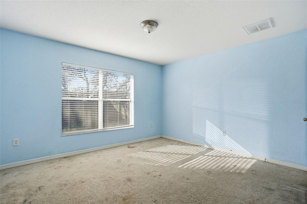 10490 Mayflower Road Spring Hill, FL 34608 - Photo 25 of 35 an empty room with a window