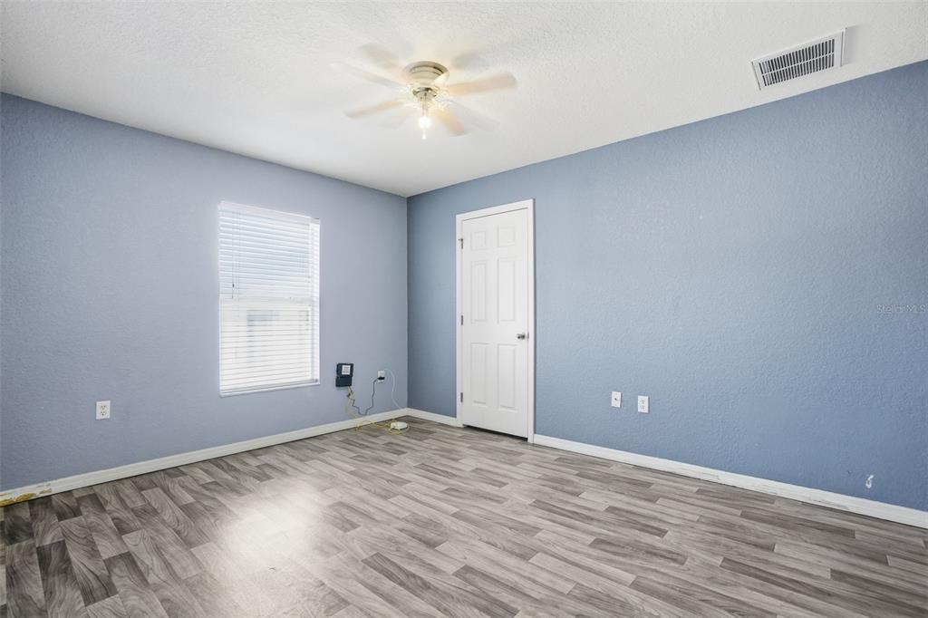 10490 Mayflower Road Spring Hill, FL 34608 - Photo 27 of 35 wooden floor in an empty room with a window