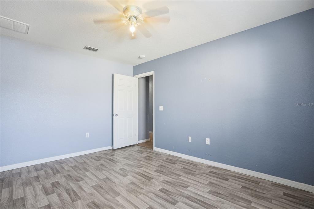 10490 Mayflower Road Spring Hill, FL 34608 - Photo 28 of 35 a view of an empty room with wooden floor
