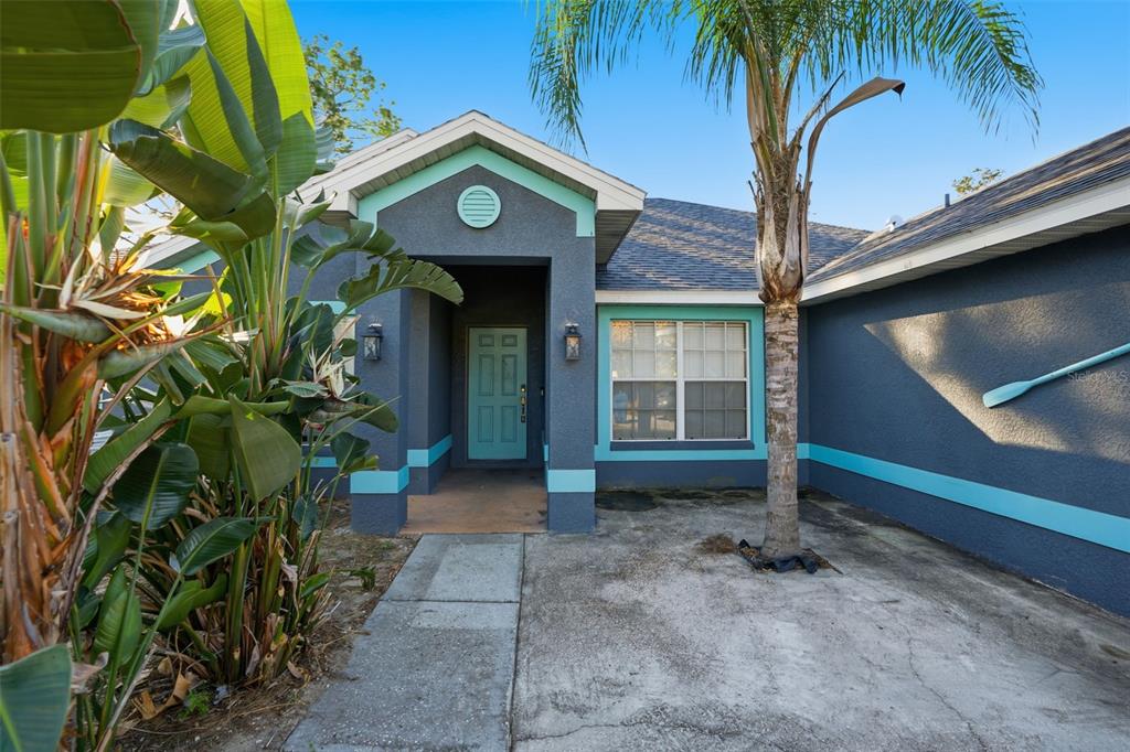 10490 Mayflower Road Spring Hill, FL 34608 - Photo 3 of 35 a view of entryway with a garden
