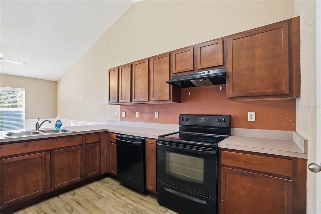 10490 Mayflower Road Spring Hill, FL 34608 - Photo 9 of 35 a kitchen with a sink and cabinets