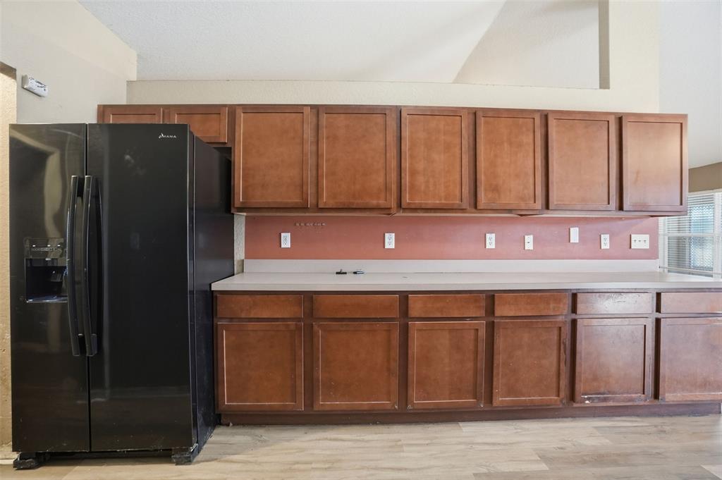 10490 Mayflower Road Spring Hill, FL 34608 - Photo 10 of 35 a kitchen with a sink cabinets and wooden floor