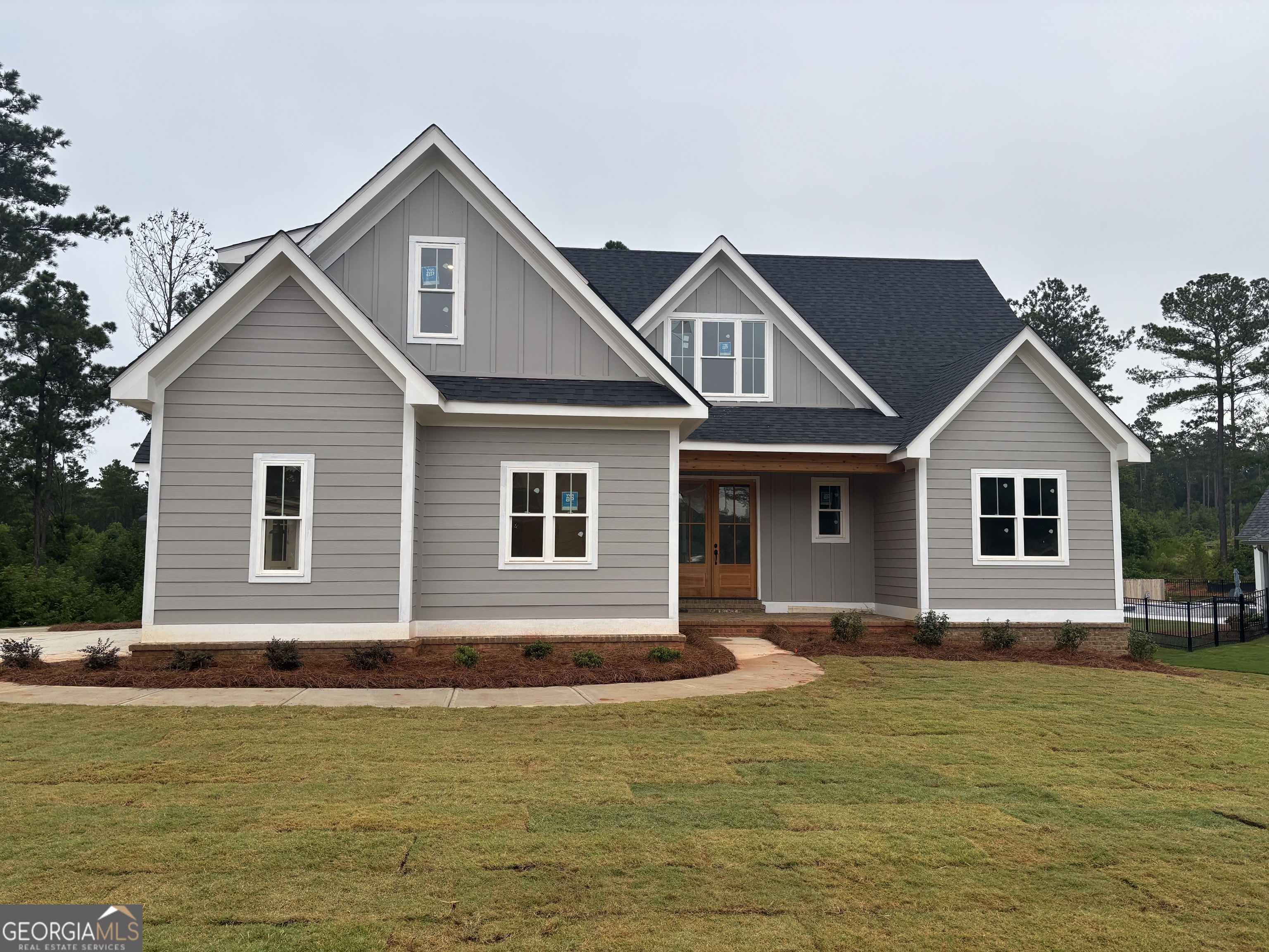 a front view of a house with swimming pool