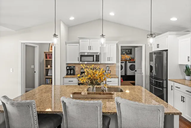 a living room with fireplace furniture and a flat screen tv