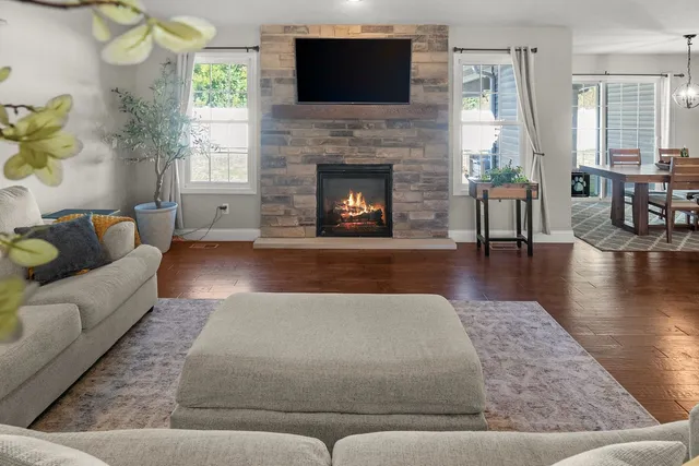 a en suite bathroom with a granite countertop double vanity sinks and a mirror