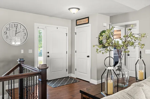 a view of living room with furniture and wooden floor