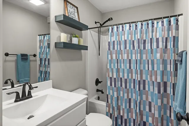 a view of staircase with white walls and a window