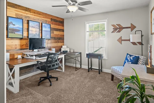a large bedroom with furniture and a flat screen tv