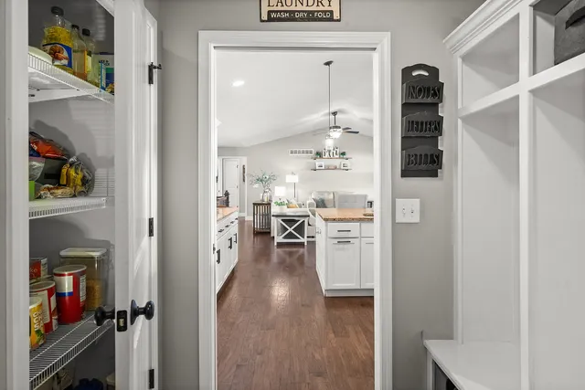a view of a livingroom with furniture and a piano
