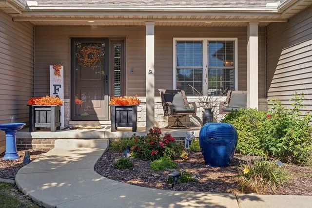 a front view of house with outdoor seating