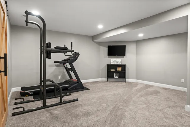 a view of a porch with chairs and potted plants