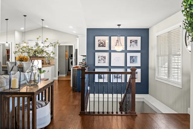 a living room with furniture and kitchen view