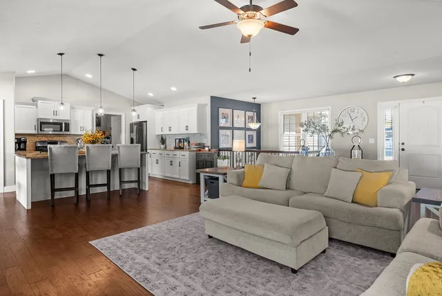 a view of a dining room with furniture and wooden floor