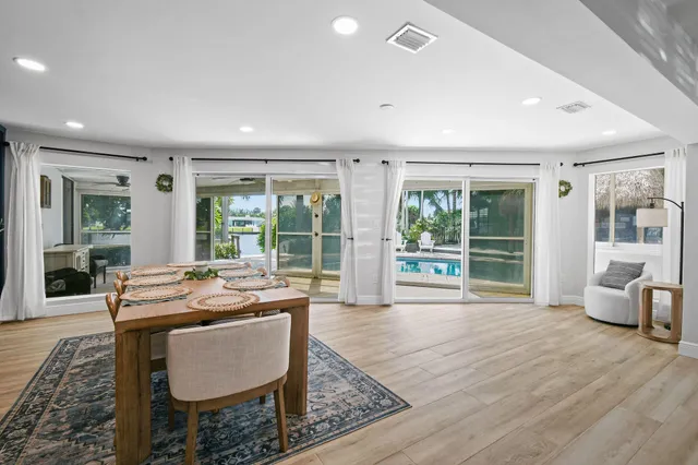 a dining room with furniture window and outside view
