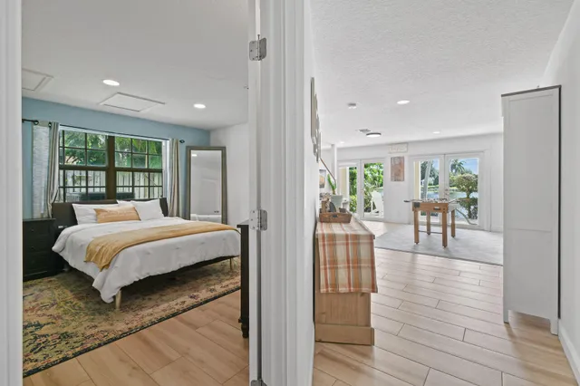 a living room with furniture and a book shelf