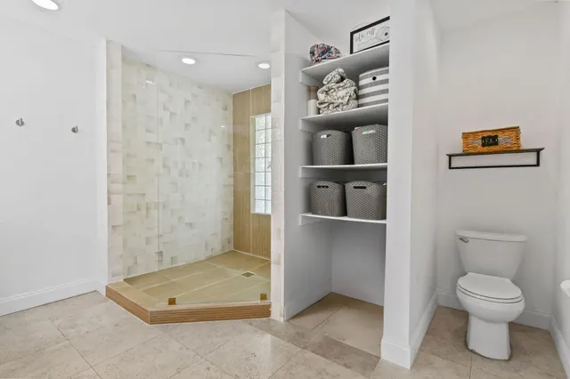 a bathroom with a granite countertop sink mirror and double