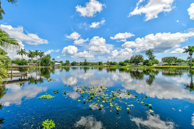 a view of a porch with furniture and garden