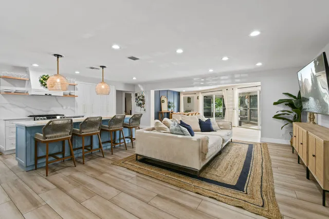 a living room with furniture fireplace and a table