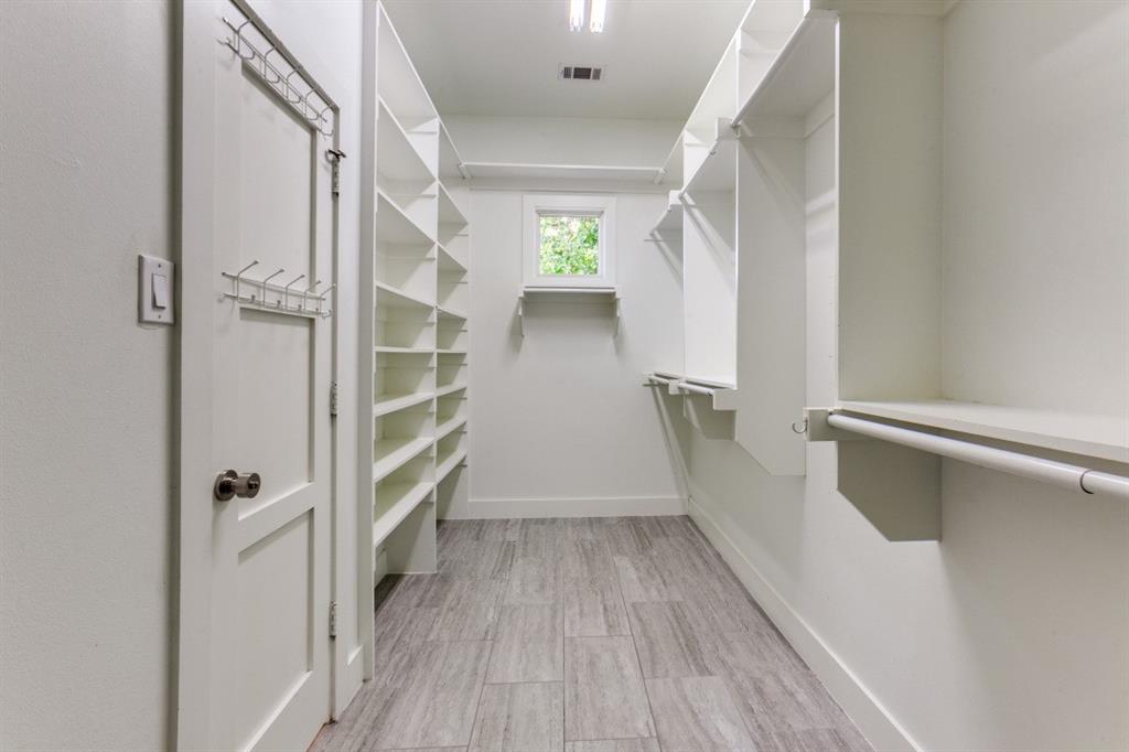 4206 Manning Lane Dallas, TX 75220 - Photo 22 of 35 a view of walk in closet with empty racks