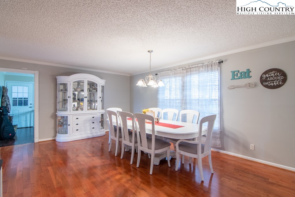 8877 Glade Valley Road Ennice, NC 28623 - Photo 15 of 49 a dining room with furniture and window