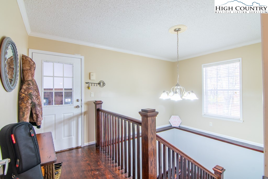 8877 Glade Valley Road Ennice, NC 28623 - Photo 17 of 49 a view of an entryway with wooden floor