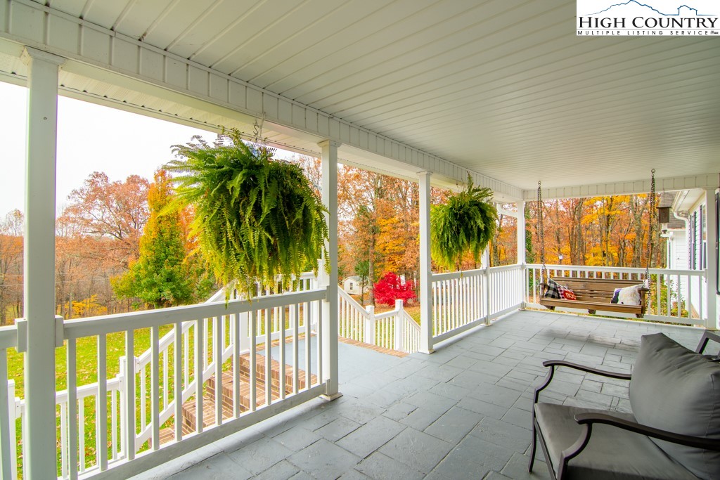 8877 Glade Valley Road Ennice, NC 28623 - Photo 2 of 49 a view of a porch with a backyard