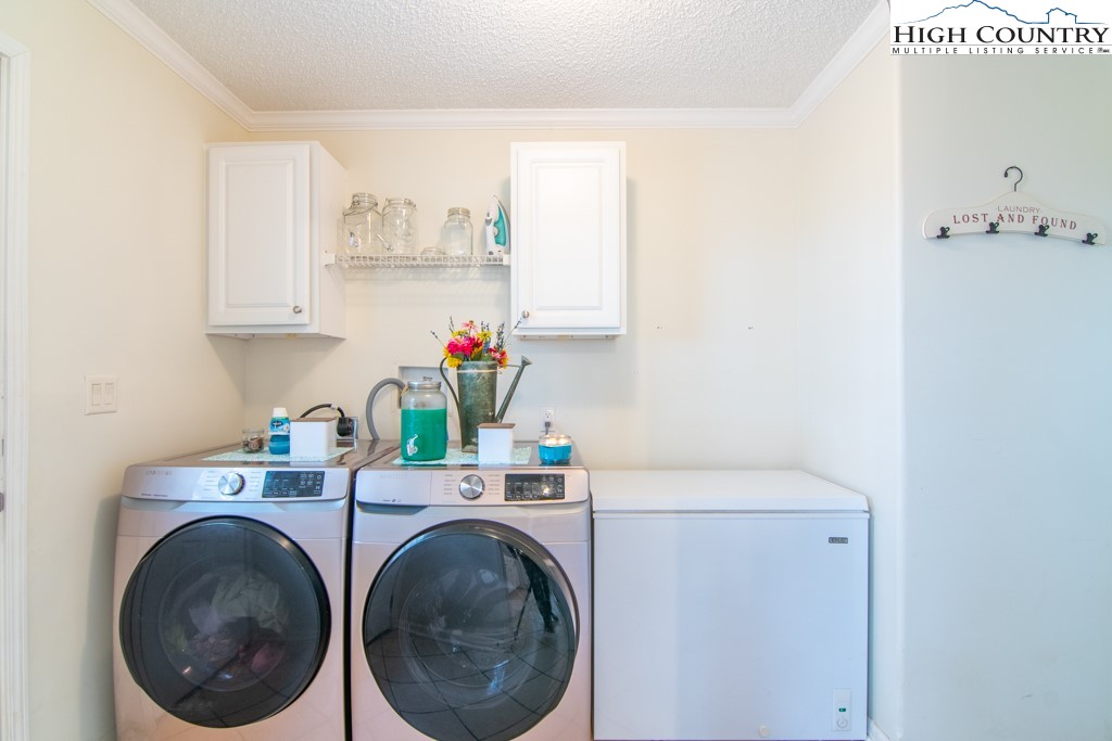 8877 Glade Valley Road Ennice, NC 28623 - Photo 31 of 49 a utility room with dryer and washer