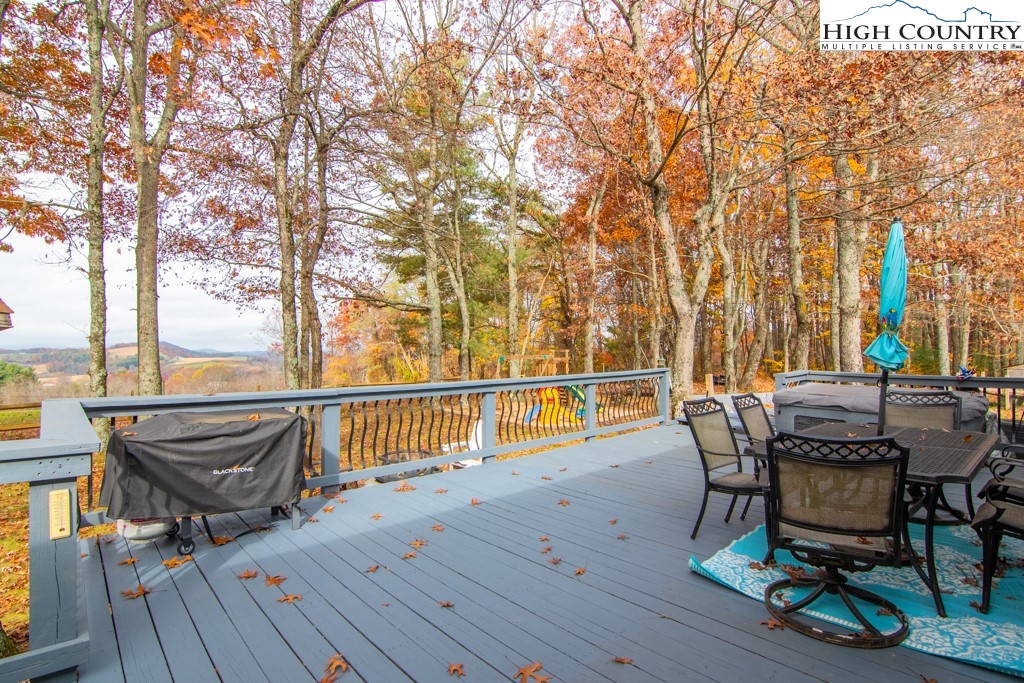 8877 Glade Valley Road Ennice, NC 28623 - Photo 45 of 49 a view of a chairs and table on the wooden floor