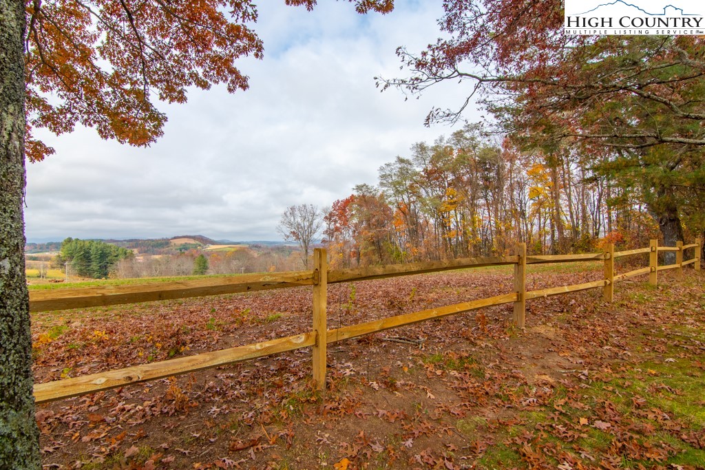 8877 Glade Valley Road Ennice, NC 28623 - Photo 48 of 49 a view of a yard with wooden fence