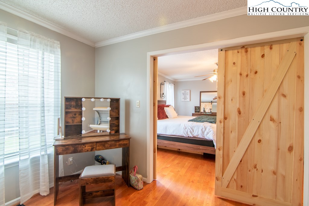 8877 Glade Valley Road Ennice, NC 28623 - Photo 10 of 49 a bedroom with furniture and a window