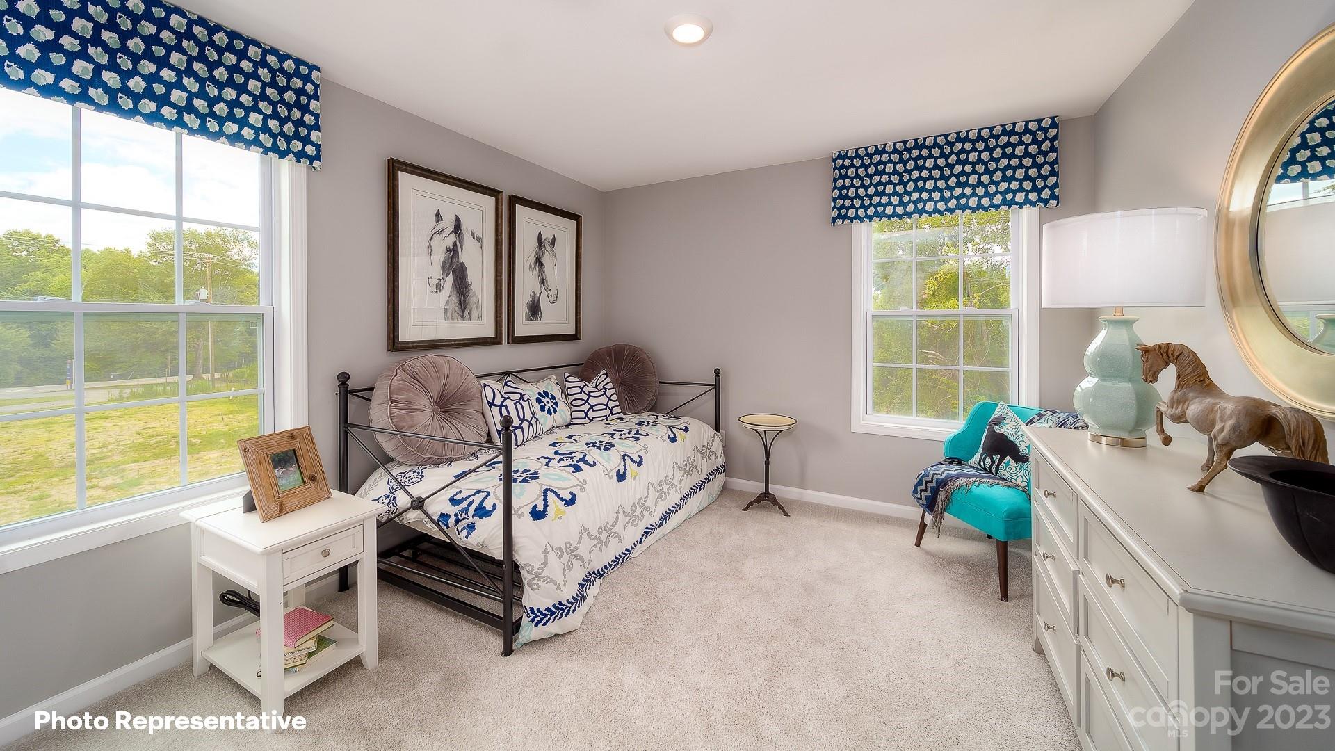 310 Streamwood Road Troutman, NC 28166 - Photo 16 of 35 a bed room with a bed and a window