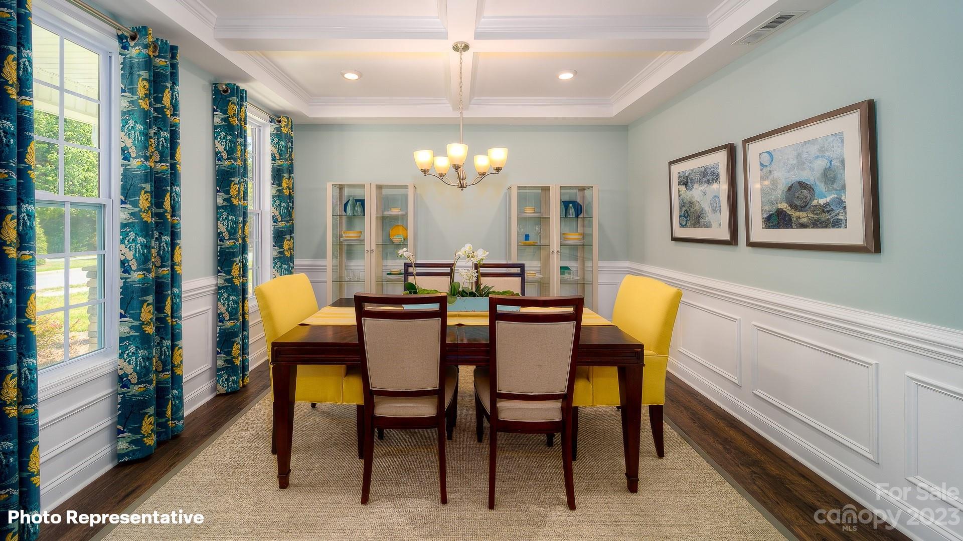 310 Streamwood Road Troutman, NC 28166 - Photo 4 of 35 a view of a dining room with furniture and chandelier