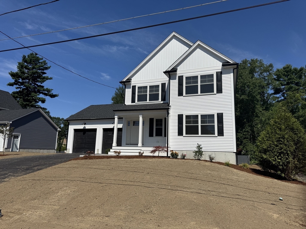 19 Barberry Road Mansfield, MA 02048 - Photo 3 of 17 a front view of a house with a small yard
