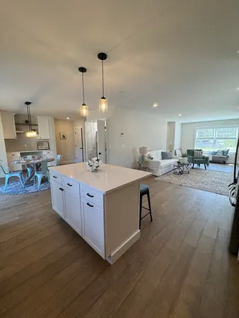 a kitchen with stainless steel appliances granite countertop a refrigerator stove a sink and dishwasher