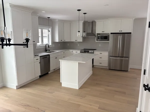 a view of cabinets and wooden floor