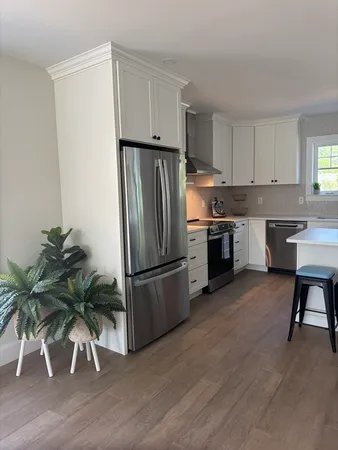 a kitchen with a sink cabinets and window