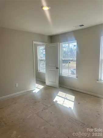 an empty room with windows