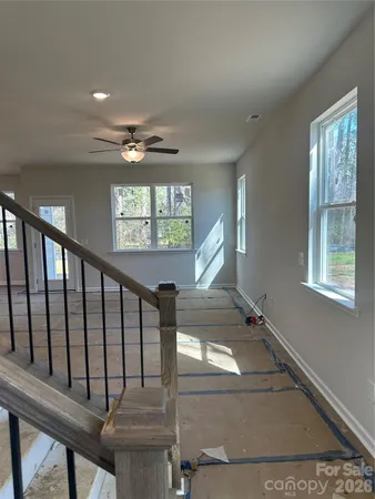 a view of entryway and hall with a window