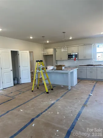 a view of kitchen with wooden floor