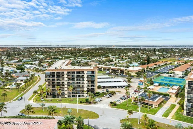 an aerial view of residential building and lake view