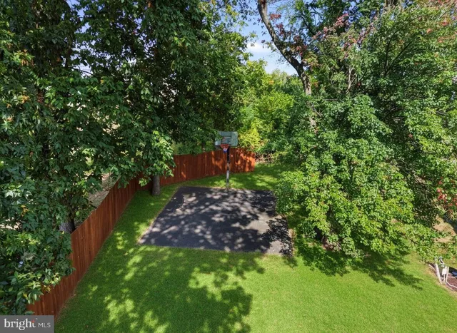 a view of a house with swimming pool and sitting area