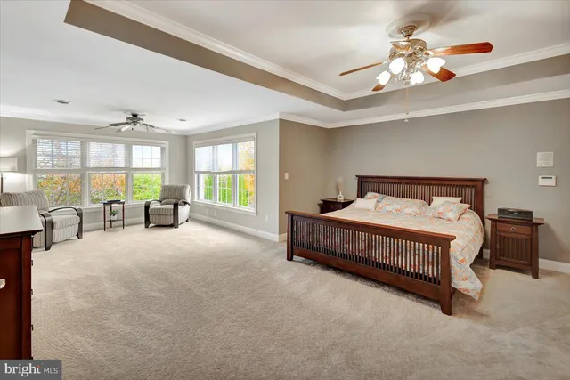a view of a patio with couches and table under an umbrella