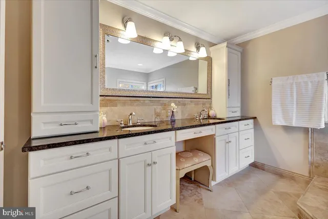 a view of house with a big yard and large trees