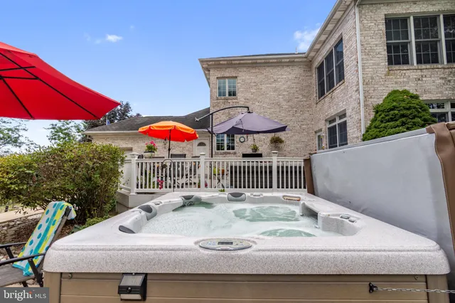 a living room with furniture and a glass door