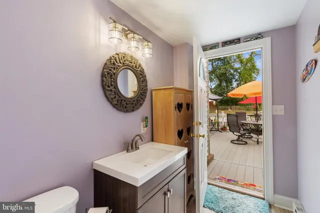 a view of a room with wooden floor and furniture