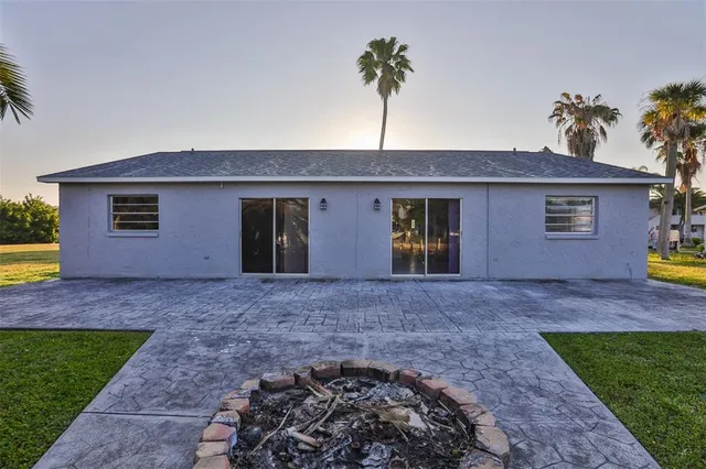 a view of a house with a yard and a garden