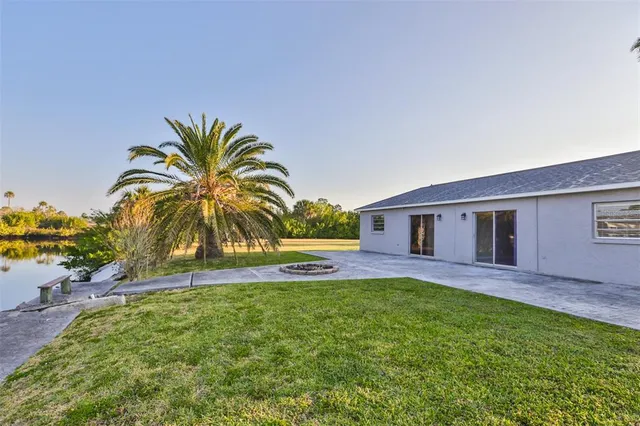 a house with swimming pool in front of it