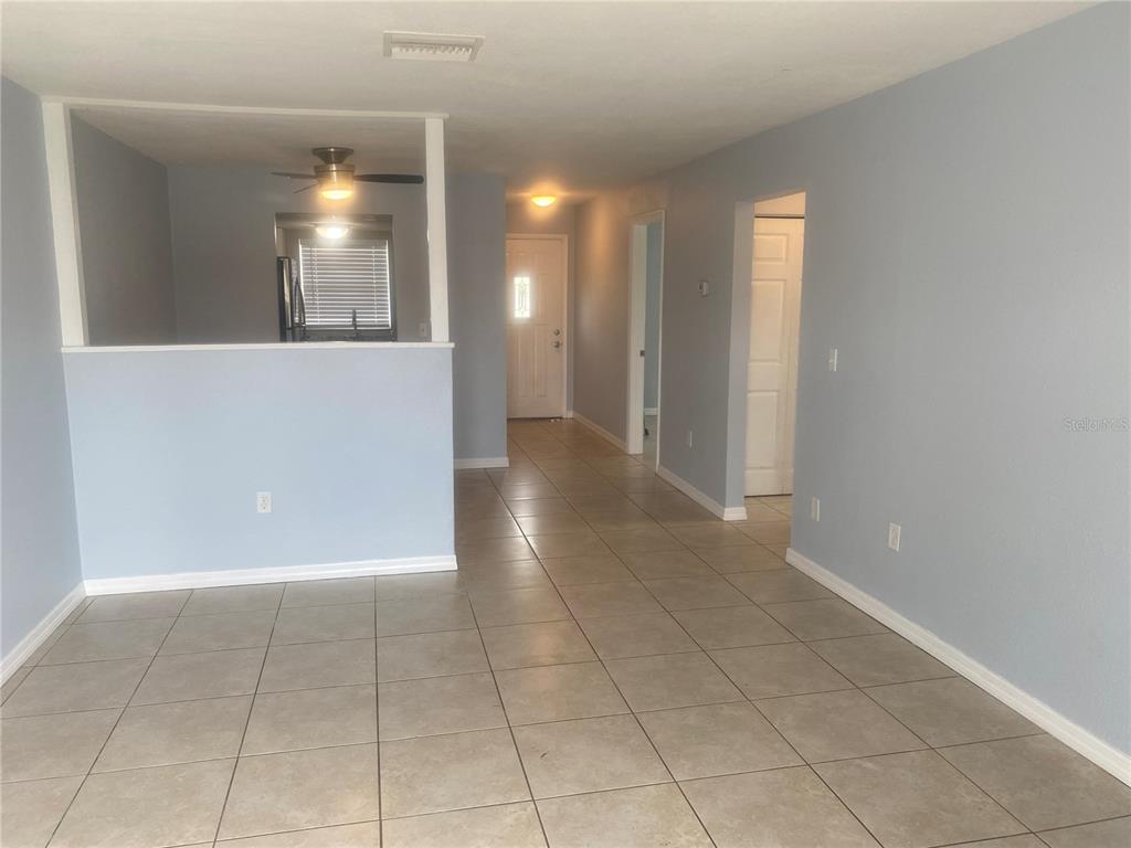 9925 Grace Drive Port Richey, FL 34668 - Photo 7 of 14 a view of a hallway with wooden shelves
